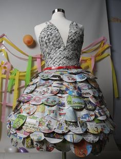 a dress made out of magazines on a mannequin