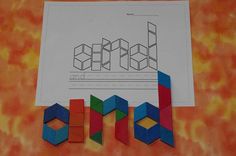 an image of children's artwork made out of colored blocks and construction paper on top of a table