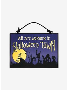 a sign that says all are welcome in halloween town with silhouettes of people and animals