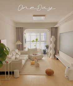 a living room filled with furniture and a flat screen tv sitting on top of a hard wood floor