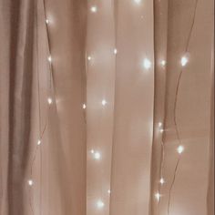 the curtains are covered with white lights