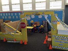 a classroom with construction themed decorations and toys