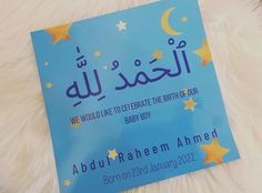 a blue sign with gold stars and the words we would like to celebrate the birth of baby boy