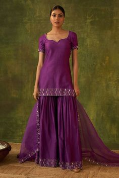 Purple kurta with mirror and zardosi hand embroidery. Comes with gharara and a dupatta. - Aza Fashions Purple Chinon Sharara For Festive Occasions, Purple Sharara With Gota Work For Party, Festive Purple Chinon Sharara, Elegant Purple Chinon Sets, Diwali Fitted Sharara With Gota Work, Fitted Sharara With Gota Work For Reception, Purple Chinon Sharara With Mirror Work, Purple Chinon Sharara For Wedding, Elegant Fitted Sharara With Gota Work