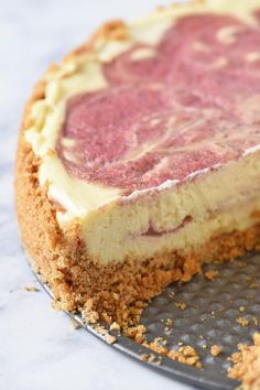 a close up of a pie on a pan with one slice missing from it's crust