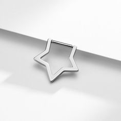 a star shaped object sitting on top of a white surface