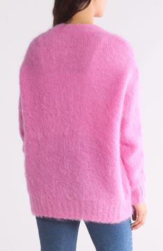 A cozy brushed blend of mohair and alpaca brings toasty texture to this cardigan that's ready to layer in chilly weather. Front button closure V-neck Long sleeves 35% mohair, 35% alpaca, 30% polyamide Dry clean Imported Cozy Pink Mohair Outerwear, Pink Mohair Long Sleeve Outerwear, Winter Pink Cardigan With Soft Texture, Pink Winter Cardigan With Soft Texture, Pink Soft Winter Cardigan, Pink Soft Texture Winter Cardigan, Pink Mohair Winter Outerwear, Pink Mohair Outerwear For Fall, Soft Pink Cardigan For Fall