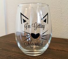 a wine glass that says i'm getting meowied on the front and back