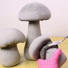 a group of mushrooms sitting on top of a wooden table