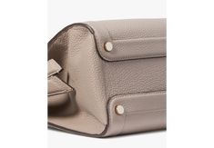 Meet the newest member of our Knott family. Designed with practicality in mind this satchel features a detchable crossbody strap and a zip-top closure for easy storage...and of course the signature cinched knotted sides. It's the satchel that ties it all together. | Kate Spade Knott Medium Zip-Top Satchel, Warm Taupe Kate Spade New York, Pebbled Leather, Zip Pockets, Kate Spade, Satchel, Leather