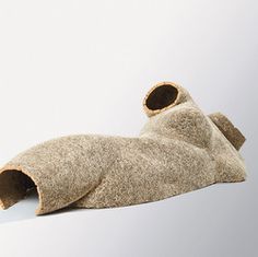 a pair of slippers laying on top of each other in front of a white background