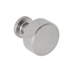 an image of a round knob on a white background with the door handle in brushed steel