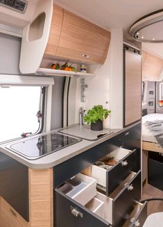 the kitchen is clean and ready to be used as a dining area in an rv