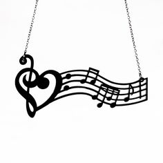 a music note with musical notes hanging from it's sides and a heart shaped treble