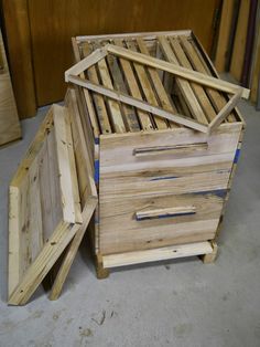 three wooden boxes stacked on top of each other