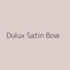 the words dulux satin bow are in black and white on a pale pink background