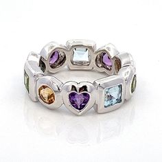 "Multi Gemstone Birthstones Sterling Silver Stacking Band Ring- Amethyst, Blue Topaz, Citrine, Peridot- Vintage Size 7.25- ET1203 Size: 7.75 - can be resized Metal Content: .925 Sterling Silver Stones: Genuine Amethyst, Blue Topaz, Citrine & Peridot Face Height (North to South): 1/4\" (7mm) Amethyst, Blue Topaz, Citrine, Peridot Stones are Genuine Weight: 7.08 Grams Stamps: KN 925 China Condition:  Excellent Pre-Owned Vintage ring  Each piece is thoroughly examined and refinished as needed by ou Multicolor Amethyst Rings With Accent Stones, Multicolor Amethyst Rings For Anniversary, Multicolor Heart Cut Multi-stone Jewelry, Multicolor Amethyst Ring With Gemstone Accents For Anniversary, Multicolor Amethyst Ring Gift, Silver Stackable Gemstones For Anniversary, Fusion Gemstones With Accent Stones For Anniversary, Anniversary Multicolor Amethyst Ring With Accent Stones, Multicolor Sterling Silver Gemstones For Anniversary