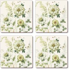 four coasters with flowers and leaves on them