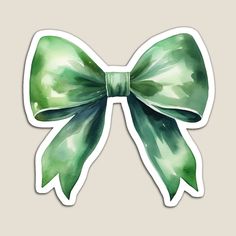 a green bow sticker with watercolor effect on the front and back of it