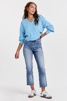 The 90s Jean in Mozzie presents a timeless style with a modern twist. Crafted from stretch denim with a high rise fit that sits slightly lower on the waist and fitted in the hips, these ankle skinnies promise a chic, sleek fit. 9 1/2" Front Rise (include waistband), 10" Leg Opening, 28" inseam (Size 27) 90% COTTON 8% POLYESTER 2% SPANDEX Machine wash cold, Tumble dry low Imported Zip fly and button closure Five-pocket style Stretch Cropped Jeans In Light Wash For Fall, Chic Cropped Jeans With Frayed Hem For Fall, Mid-rise Jeans For Elevated Casual Spring Wear, Spring Mid-rise Jeans For Elevated Casual Occasions, Fall Cropped Jeans With Frayed Hem And Relaxed Fit, Spring Elevated Casual Mid-rise Jeans, Chic Cropped Denim Blue Jeans, Modern High Rise Bottoms With Frayed Hem, Elevated Casual High Rise Jeans For Spring