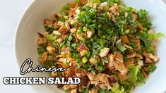 chicken salad with lettuce and carrots in a white bowl