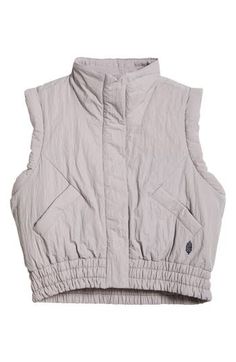 Stay warm and be cool in this lightly puffed vest made from moisture-wicking, water-resistant fabric. 21 1/2" length Front snap closure Stand collar Front zip-welt pockets Elastic waist Moisture-wicking fabric engineered for dryness and comfort Water-resistant Lined, with 100% recycled-polyester fill 100% recycled nylon Machine wash, dry flat Imported Spring Nylon Puffer Vest, Trendy Nylon Spring Vest, Trendy Nylon Vest For Spring, Trendy Spring Nylon Vest, Spring Outdoor Nylon Vest, Sporty Spring Vest For Outdoor Activities, Sporty Sleeveless Puffer Vest, Spring Nylon Stretch Vest, Spring Season Stretch Nylon Vest