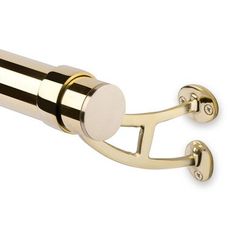 a gold door handle with two round knobs on it's end and a white background