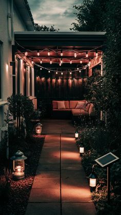 an outdoor patio with lanterns and lights on it