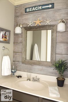 a bathroom sink with a mirror above it