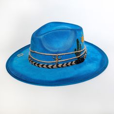 Handmade cowboy hat made with high quality fabrics and trims. ETA can take up to 14 days to delivered due to the fact that each pieces are handmade Braided trims with cactus and sun embroidery detail Western Style Blue Sun Hat With Flat Brim, Western Blue Sun Hat With Flat Brim, Summer Country Style Felt Hat For Beach, Summer Beach Country Style Felt Hat, Western Style Felt Hat For Beach In Summer, Blue Western Straw Hat With Curved Brim, Blue Western Hat For Vacation, Blue Short Brim Hat For Ranch, Flat Brim Blue Hats For Ranch