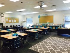 an empty classroom with desks and chairs