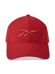 a red baseball cap with the letter x on it