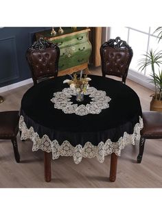 a black table with white lace on it