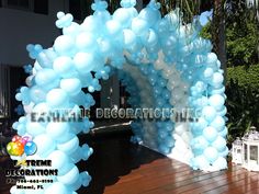 an arch made out of balloons on a deck