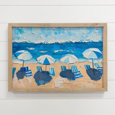 a painting of beach chairs and umbrellas in front of the ocean on a white wall