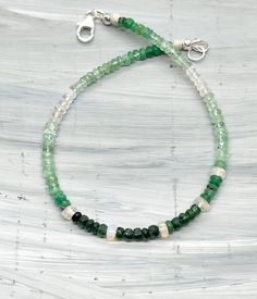 💚✨ Gorgeous Natural Faceted Emerald with Opals Ombré Beaded Bracelet ✨💚 I've added 5 stunning opals to represent the 5th month, May! 🌸 Features: - Handmade with love by me 💖 - 7.5 inches - 14 carats total Rondelle faceted Emeralds (2-3mm) - 1 carat total faceted Opals (5 at 3mm) - Sterling Silver Lobster Clasp and Findings I've strung these beautiful jewels on sterling silver flex wire for comfort and durability. 💚 Why You'll Love It: 💚 - The combination of rich greens from the Emeralds wi Ombre Bracelet, Month May, May Birthstone, Healing Bracelets, Hand Crafted Gifts, Bead Jewellery, Bracelet Handmade, Natural Emerald, 1 Carat