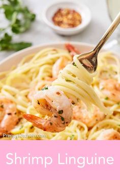 the shrimp linguine is being held up by a fork