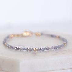 You will love this this dainty blue tanzanite bracelet! The vibrant tanzanite beads are  paired with subtle gold-filled accent beads, giving it just the right amount of shimmer. The adjustable clasp makes it super easy to get the perfect fit, whether you're wearing it solo or stacking it with your other favorites. This bracelet is the perfect mix of casual and chic, making it a go-to piece for any occasion. This bracelet is hand made and uses only natural products.  It is waterproof and will not Tanzanite Beads, Rustic Accessories, Tanzanite Bracelet, Cave Creek, Tanzanite Gemstone, Blue Tanzanite, December Birthstone, Bijoux Diy, Natural Products