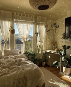 the bedroom is decorated with plants and lights