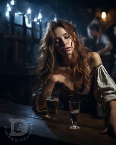 a woman sitting at a table with two glasses