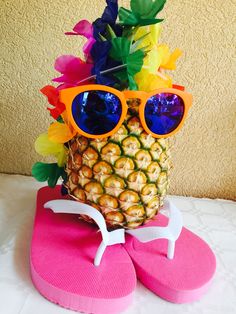 a pineapple with sunglasses on top of it