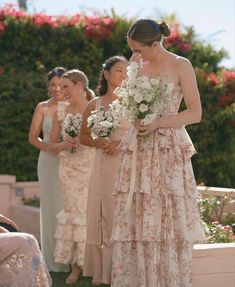 the bridesmaids are getting ready to walk down the aisle