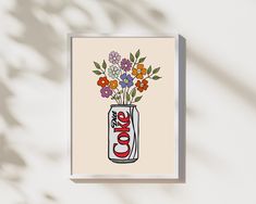 a card with an image of a coke can and flowers in it on a white background