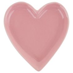 a pink heart shaped dish on a white background