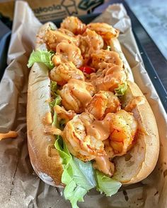 a sandwich with shrimp and lettuce on it