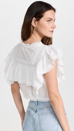 LoveShackFancy Nora Top | Shopbop Fitted Top With Lace Trim And Flutter Sleeves, Summer Pintucks Blouse, Daywear Tops With Lace Trim And Flutter Sleeves, Chic Blouse With Lace Trim And Flutter Sleeves, Fitted Flutter Sleeve Tops For Daywear, Flutter Sleeve Tops With Lace Trim For Daywear, Fitted Blouse With Lace Trim And Ruffle Sleeves, Daywear Blouse With Lace Trim And Ruffle Sleeve, Elegant Blouse With Lace Trim And Flutter Sleeves