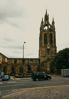 an old church with a clock tower in the middle of it's center square