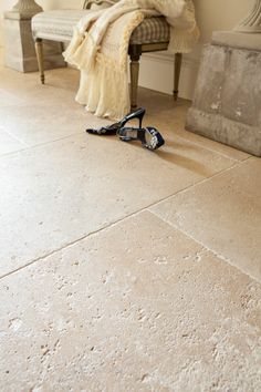 a pair of shoes sitting on the floor next to a chair