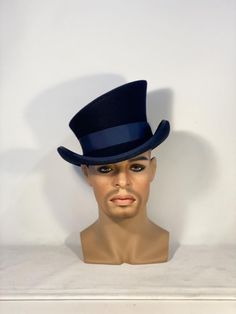 * Stunning asymmetric top hat from wool felt, stiffened and hand blocked over millinery wooden hat blocks. It is my signature design and any attempt to copy it will be denounced. * ENTIRELY HAND SEWN. It is an artisan product, completely handmade, none of the pieces I make is absolutely identical to another. Made to order. I personally design and handcraft each headpiece with care and great attention to detail. I do not have all these hats in stock, they are made one by one, according to the siz Fitted Top Hat With Curved Brim For Costume, Victorian Top Hat With High Crown For Formal Events, Victorian High Crown Top Hat For Formal Occasions, Elegant Top Hat With Short Brim For Costume, Elegant Costume Top Hat With Short Brim, Elegant Short Brim Top Hat For Costume, Victorian Top Hat With Short Brim For Formal Occasions, Curved Brim Top Hat For Kentucky Derby Costume, Fitted Top Hat For Kentucky Derby Costume