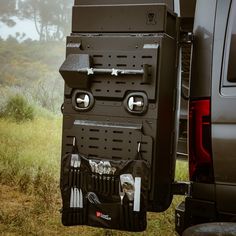 the back end of a truck with utensils in it